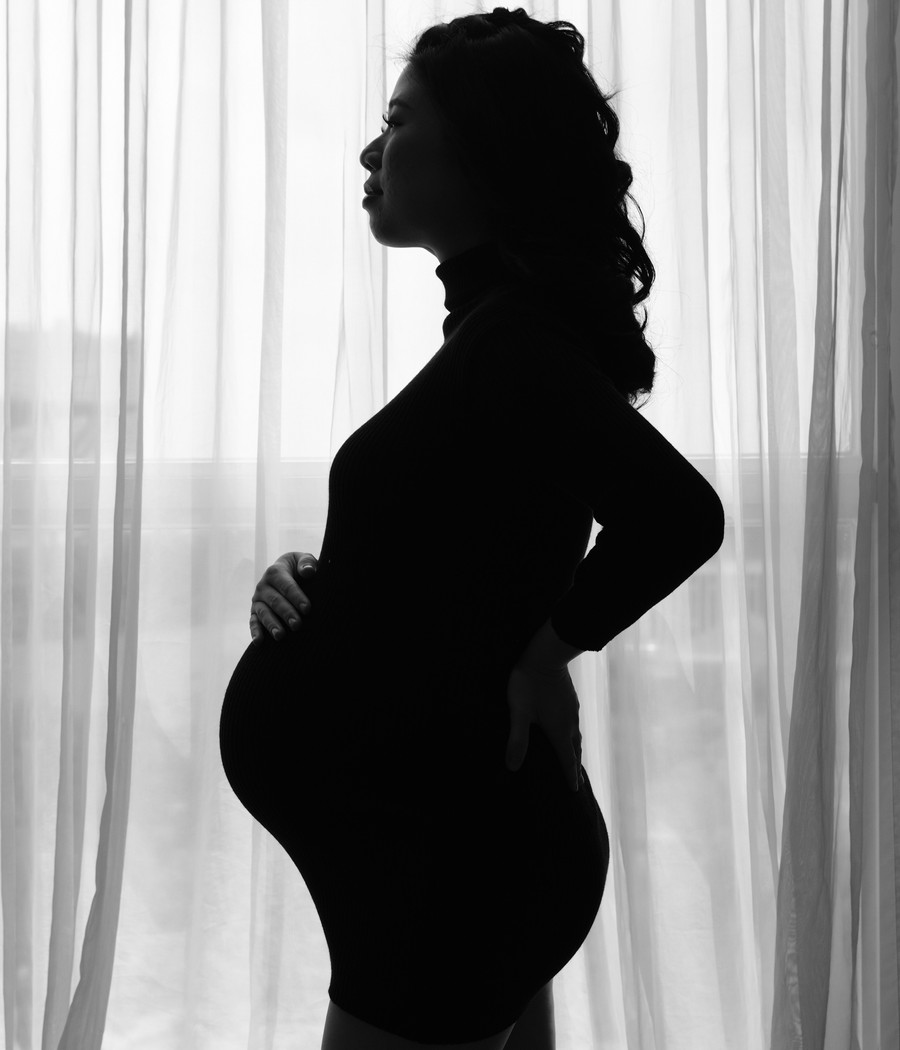 A pregnant worker on the job, representing rights under the Pregnant Workers Fairness Act in Illinois